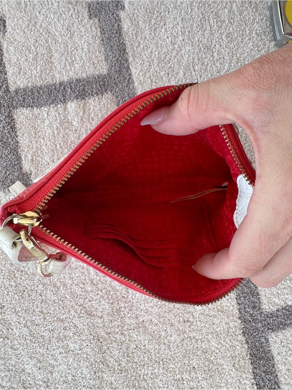 kate spade Red Pebbled Leather Wristlet with Ivory Tassel